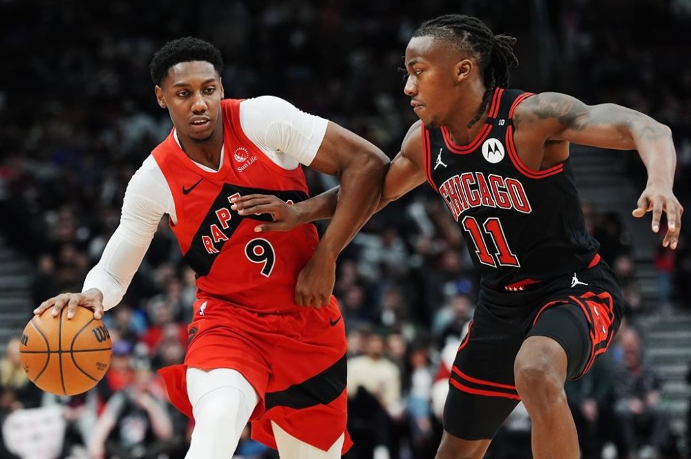Canadian swingman RJ Barrett will miss tonight's Toronto Raptors game against the Brooklyn Nets. Toronto Raptors' RJ Barrett (9) protects the ball from Chicago Bulls' Ayo Dosunmu (11) during second half NBA basketball action in Toronto on Monday, December 16, 2024. THE CANADIAN PRESS/Frank Gunn