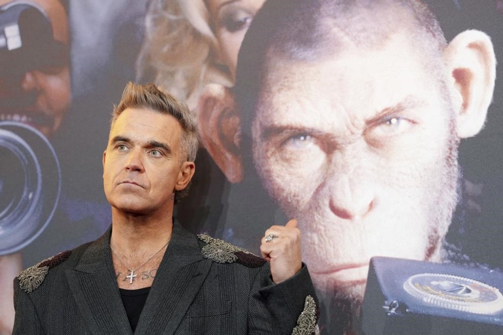 Robbie Williams poses for photographers upon arrival at the European premiere for the film 'Better Man' on Wednesday, Nov. 27, 2024, in London. (Photo by Scott A Garfitt/Invision/AP)