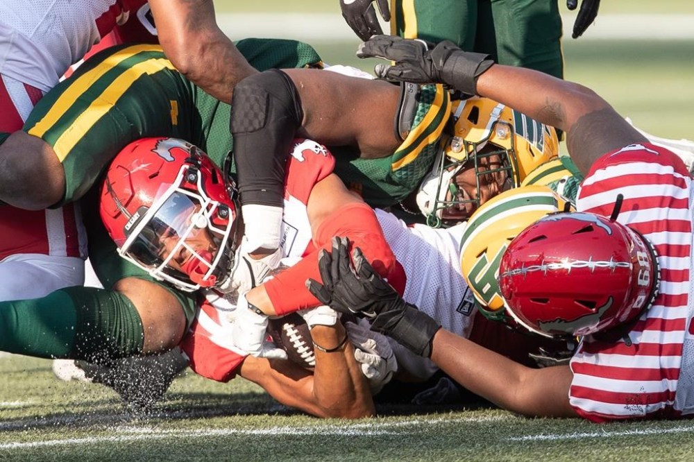The Calgary Stampeders have signed Canadian receiver Jalen Philpot to a two-year contract, the CFL club announced Friday, Dec. 20, 2024. Philpot (85) gets tackled by Edmonton Elks Daniel Joseph (49) along with Calgary's Eric Smith (68) during CFL action in Edmonton, Alberta, on Saturday September 7, 2024. THE CANADIAN PRESS/Amber Bracken