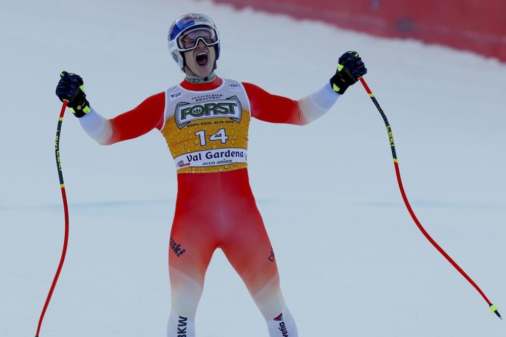 Switzerland's Marco Odermatt celebratesat the finish area of an alpine ski, men's World Cup downhill, in Val Gardena, Italy, Saturday, Dec. 21, 2024. (AP Photo/Alessandro Trovati)