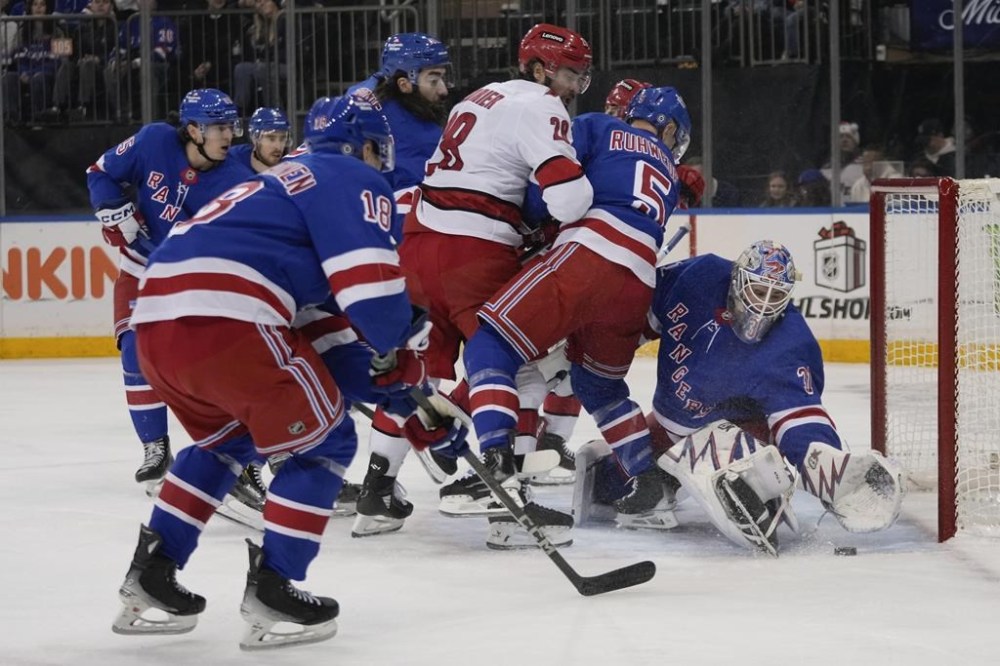 New York Rangers goaltender Igor Shesterkin (31) protects the net from Carolina Hurricanes' William Carrier (28) during the first period of an NHL hockey game Sunday, Dec. 22, 2024, in New York. (AP Photo/Frank Franklin II)