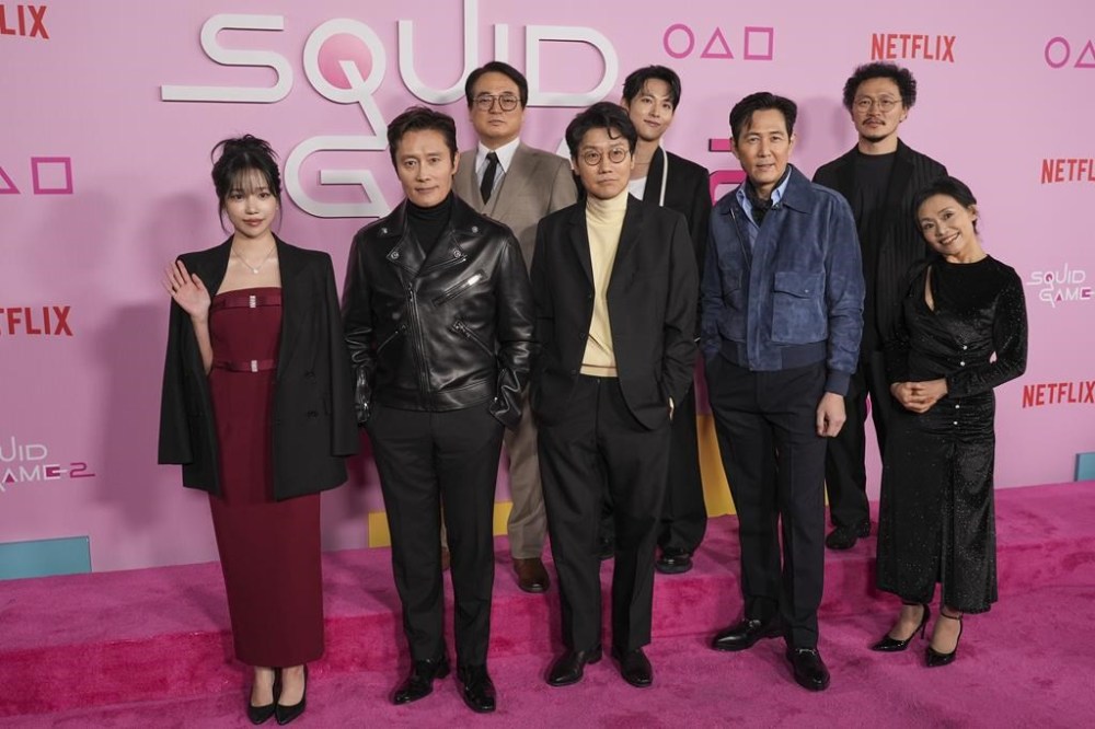 Jo Yu-ri, from left, Lee Byung-hun, Lee Seo-hwan, Hwang Dong-hyuk, Im Si-wan, Lee Jung-jae, Yang Dong-geun, and Kang Ae-sim arrive at the premiere of the second season of