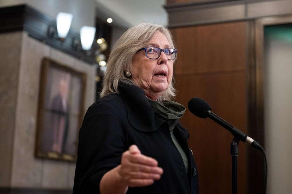 Green Party Leader Elizabeth May speaks in the Foyer of the House of Commons on Parliament Hill in Ottawa, Thursday, Dec. 12, 2024. THE CANADIAN PRESS/Spencer Colby