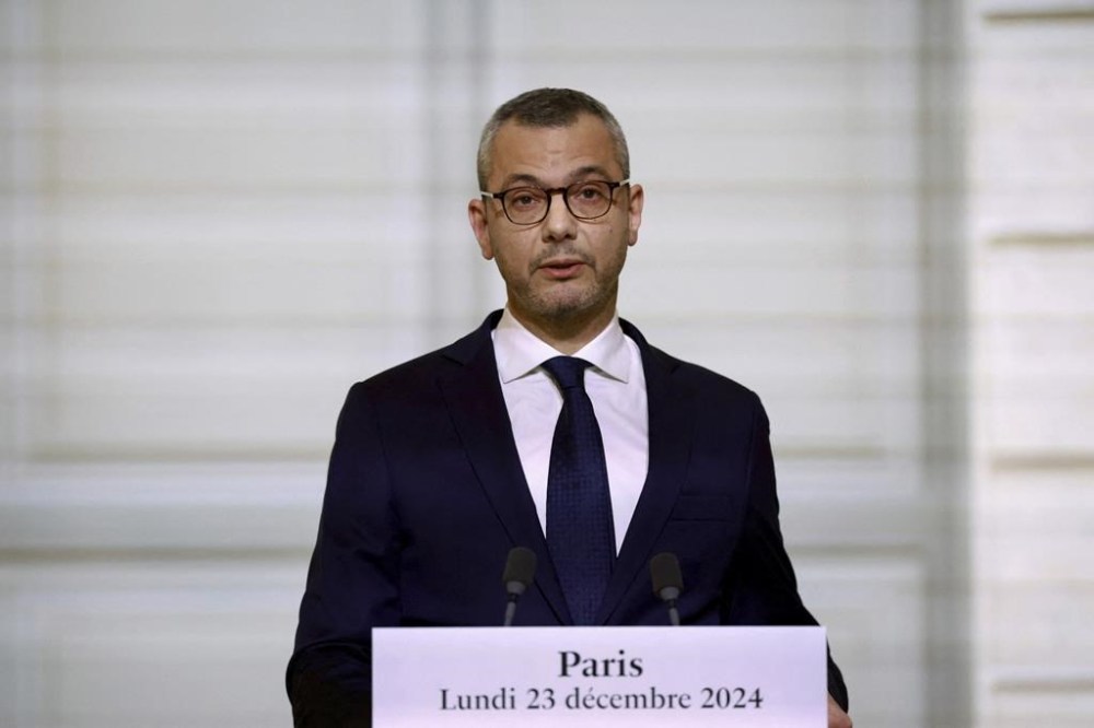 Alexis Kohler, Secretary-General of the Elysee Palace, announces the names of the ministers of the new cabinet, in the Elysee Palace, Monday, Dec 23, 2024 in Paris. French President Emmanuel Macron's office announced a new government, after the previous Cabinet collapsed in a historic vote prompted by fighting over France's budget. (Saboor Abdul/Pool via AP)