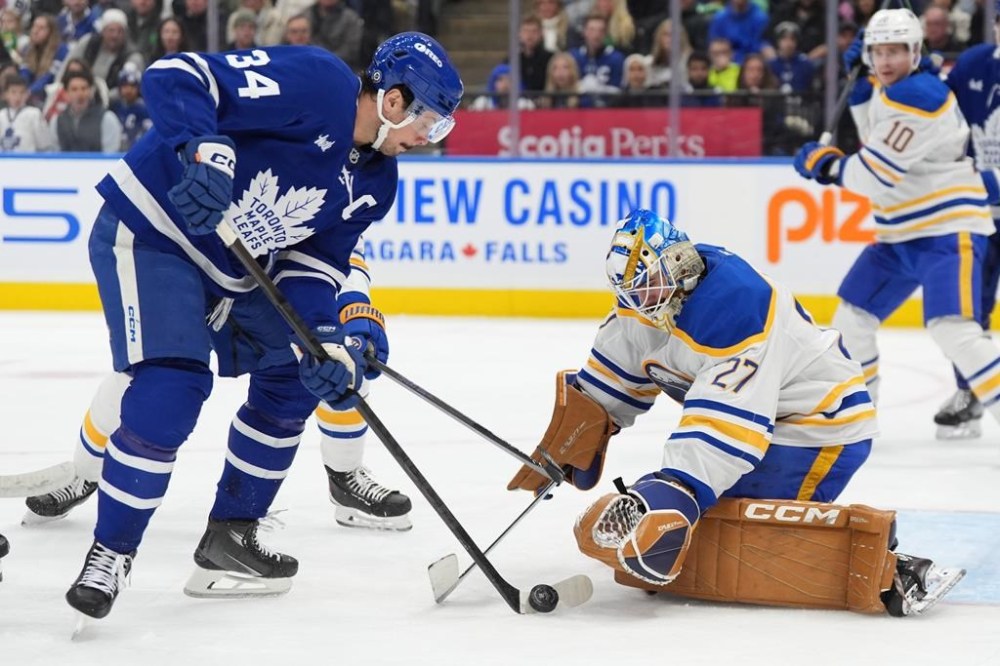 Toronto Maple Leafs captain Auston Matthews will miss his second consecutive game Monday against the Winnipeg Jets due to an undisclosed injury. Matthews (34) is stopped by Buffalo Sabres goaltender Devon Levi during second-period NHL hockey action in Toronto, Sunday, Dec. 15, 2024. THE CANADIAN PRESS/Frank Gunn