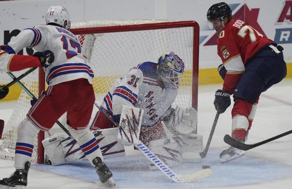 New York Rangers goaltender Igor Shesterkin (31) defends the goal against Florida Panthers center Jesper Boqvist (70) during the third period of an NHL hockey game Monday, Dec. 30, 2024, in Sunrise, Fla. (AP Photo/Lynne Sladky)