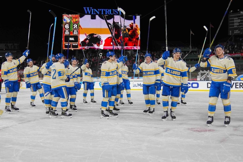 The St. Louis Blues celebrate after their win over the Chicago Blackhawks in the NHL Winter Classic outdoor hockey game at Wrigley Field, Tuesday, Dec. 31, 2024, in Chicago. (AP Photo/Erin Hooley)