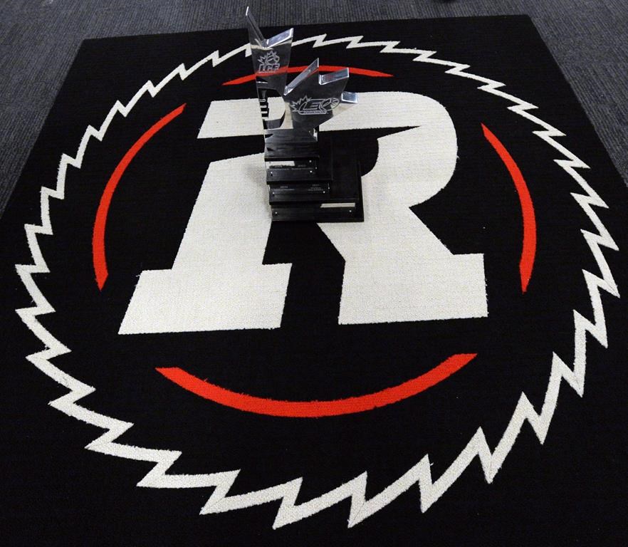 The Ottawa Redblacks hired William Fields as their defensive co-ordinator and secondary coach Monday. The Ottawa Redblacks celebrate with the East Division trophy on their logo in the locker room after defeating the Hamilton Tiger-Cats in the CFL East Division final in Ottawa on Sunday, Nov. 22, 2015. THE CANADIAN PRESS/Sean Kilpatrick