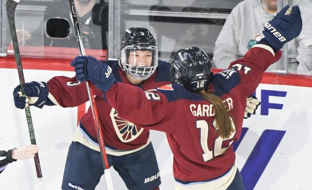 Montreal Victoire's Cayla Barnes (3) celebrates with teammate Jennifer Gardiner (12) after scoring against the New York Sirens during PWHL hockey action in Laval, Que., Wednesday, December 4, 2024. THE CANADIAN PRESS/Graham Hughes