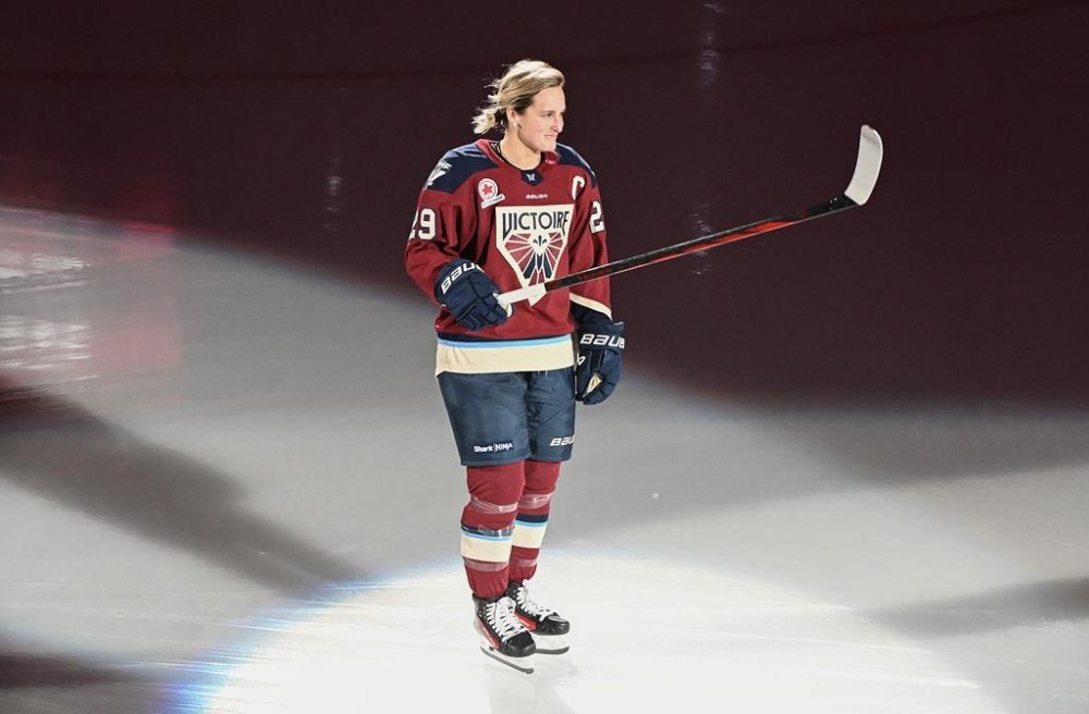 Montreal Victoire's Marie-Philip Poulin salutes the crowd as she's introduced before PWHL hockey action against the Ottawa Charge, in Laval, Que., Nov. 30, 2024. THE CANADIAN PRESS/Graham Hughes