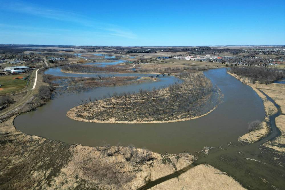 Water from the swollen Assiniboine River floods low-lying areas bordering the riverbanks in Brandon. (Tim Smith/The Brandon Sun)