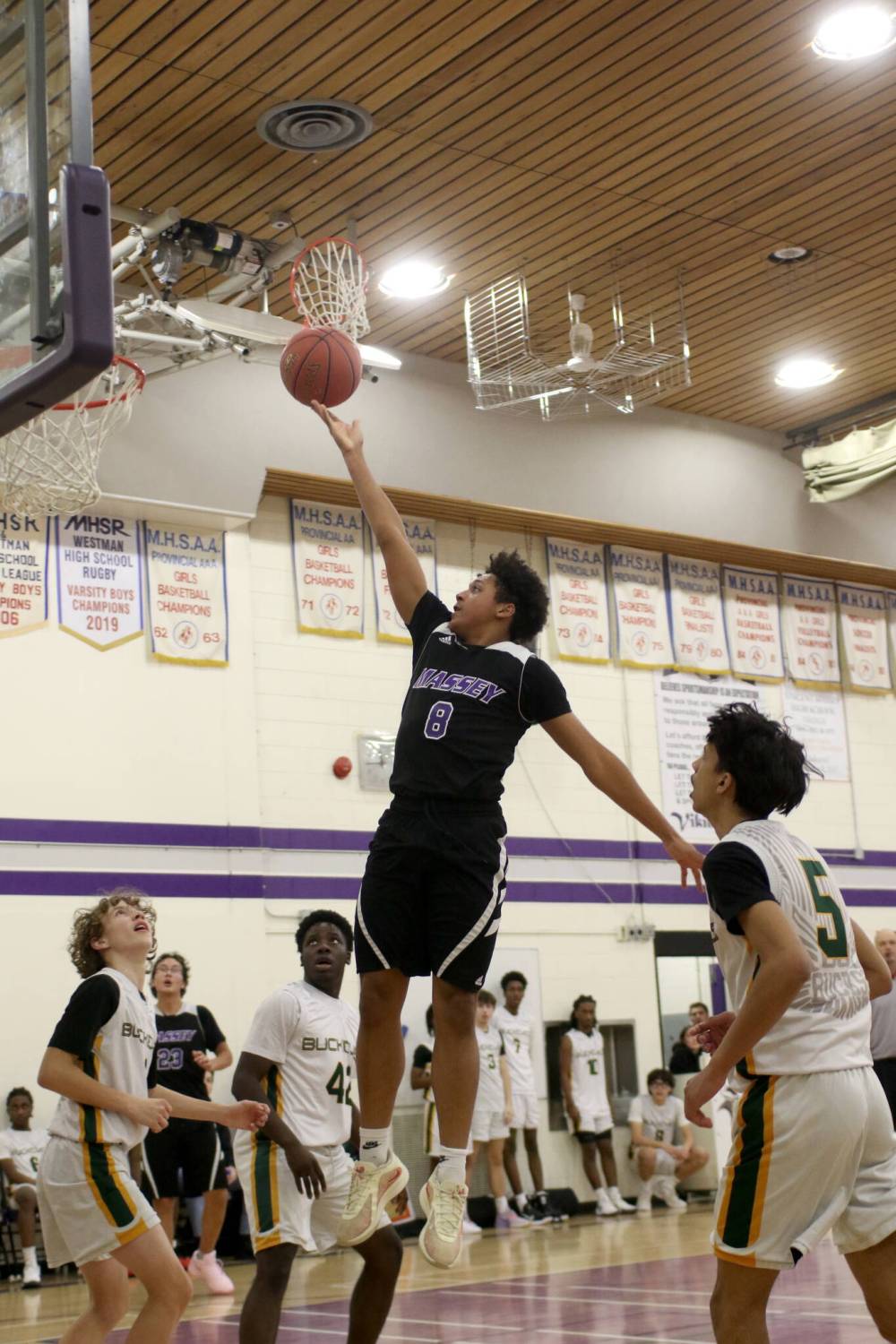 Vincent Massey’s Knox Smith rises for a layup against Miles Macdonell during their Friday morning game. (Thomas Friesen/The Brandon Sun)