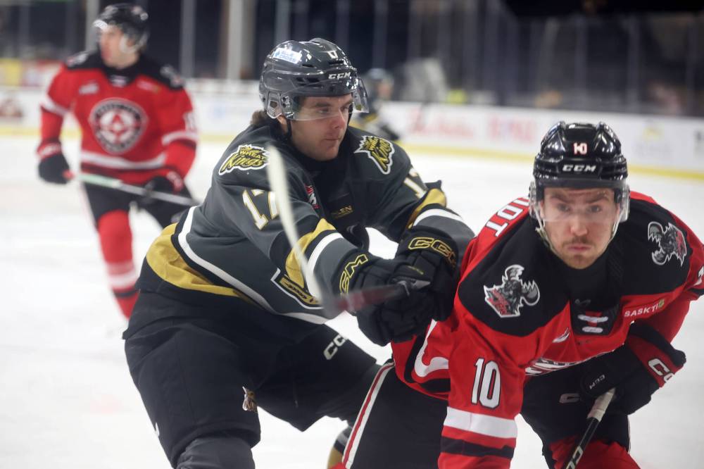 Joby Baumuller of the Brandon Wheat Kings shoves Connor Schmidt of the Moose Jaw Warriors during WHL action at Westoba Place on Tuesday evening. (Tim Smith/The Brandon Sun)