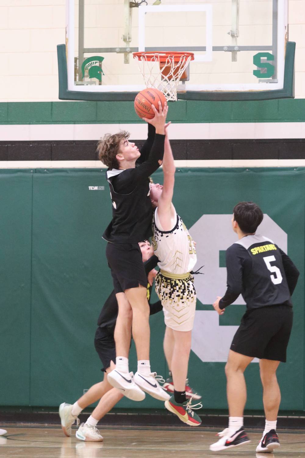 Neelin's Kal-El Wilson fights for a rebound over Carberry's Brayden Bobier in the Source for Sports division semifinal. (Matt Packwood/The Brandon Sun)