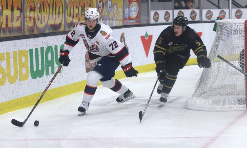Brandon Wheat Kings forward Dylan Ronald (5) cuts off Regina Pats forward Julien Maze (72) from taking the puck to the net during Western Hockey League action at Westoba Place on Friday. (Perry Bergson/The Brandon Sun)