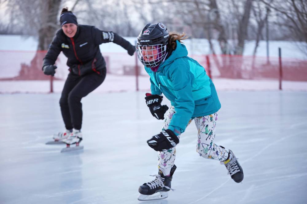 Sophia Forbes and her mom Jen skate together at the Brandon Skating Oval at sunset. (File)