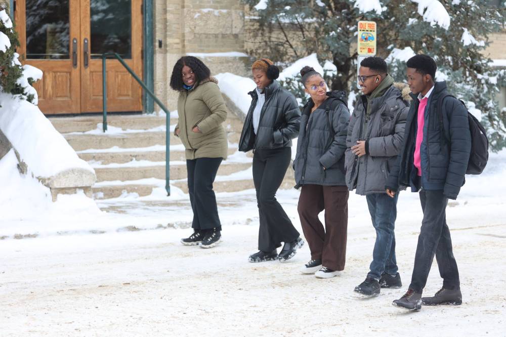 Brandon University International students Tolu Oke, Jessica Ehirim, Rejoice Ifeuwa, Goodness Ibeh and Tosin Salau walk in front of Clark Hall toward the Knowles Douglas Building on Saturday. BU is grappling with the fallout from a decline in international student enrolment. (Abiola Odutola/The Brandon Sun)