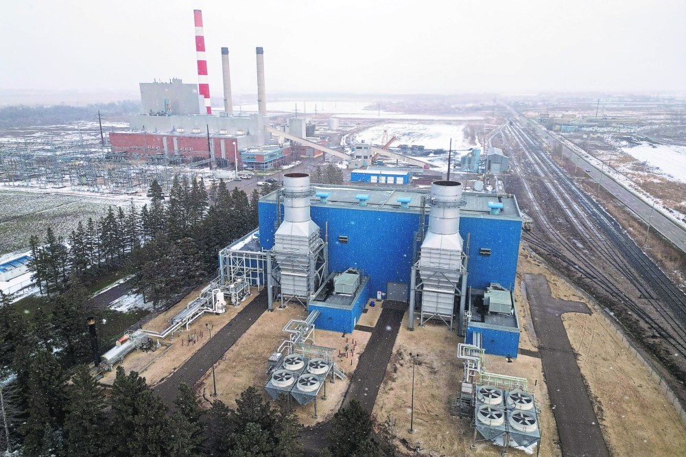 The Manitoba Hydro Brandon Generating Station is seen from a drone in this 2023 photograph, with the Assiniboine River in the background. (The Brandon Sun)