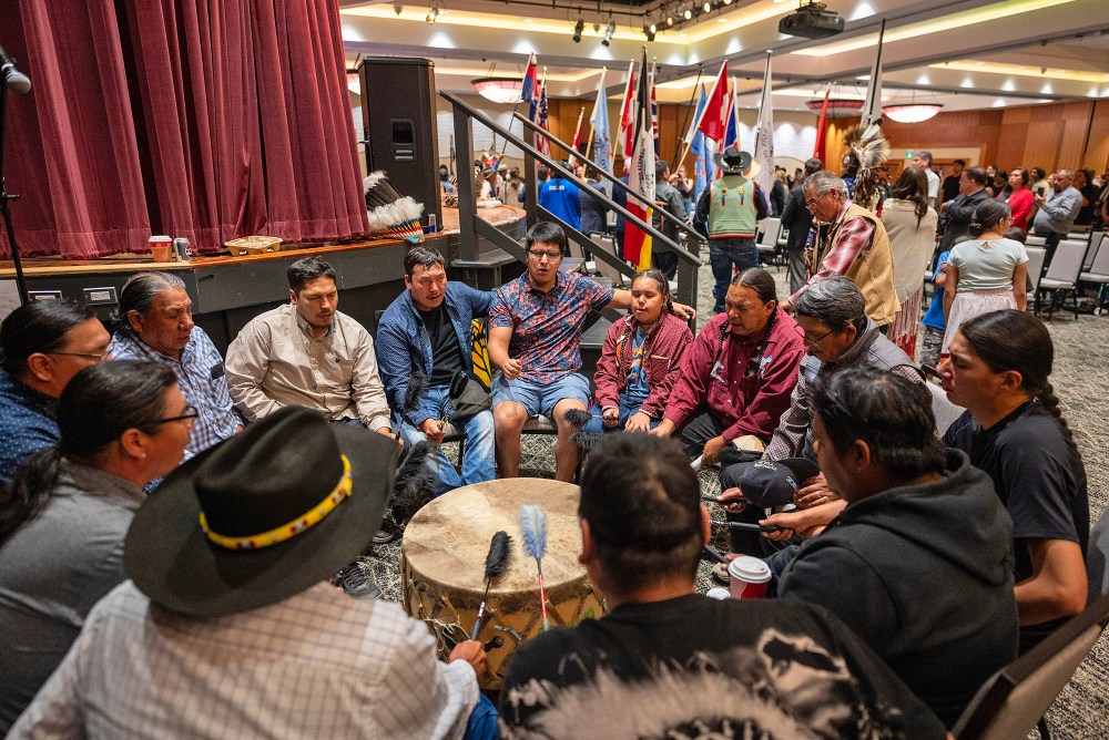 Drummers perform a victory song during a ceremony where the Government of Canada delivered a formal apology to the 9 Dakota and Lakota First Nations in Canada in Whitecap Dakota Nation, Saskatchewan on Monday, July 15, 2024. THE CANADIAN PRESS/Liam Richards