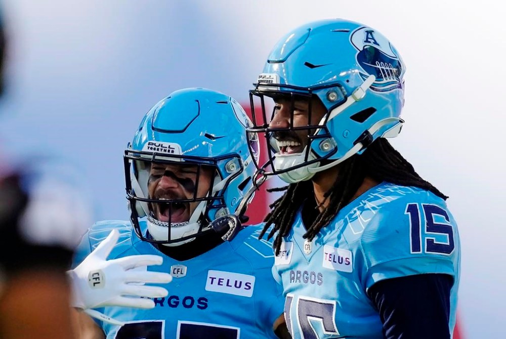 Toronto Argonauts wide receiver Makai Polk (15) celebrates his touchdown with teammate David Ungerer III (83) during first half Eastern Conference semifinal CFL football action against the Ottawa Redblacks, in Toronto, Saturday, Nov. 2, 2024. THE CANADIAN PRESS/Frank Gunn