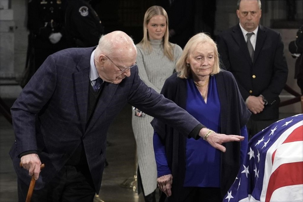 Former Sen. Patrick Leahy and his wife Marcelle pause at the flag-draped casket of former President Jimmy Carter as he lies in state in the rotunda of the U.S. Capitol in Washington, Wednesday, Jan. 8, 2025. (AP Photo/J. Scott Applewhite)