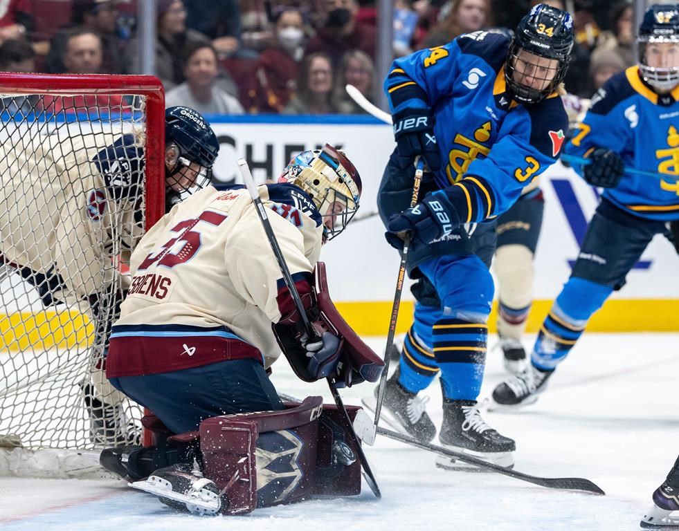 Montreal Victoire goaltender Ann-Renee Desbiens (35) stops Toronto Sceptres' Hannah Miller (34) during second period PWHL hockey action in Vancouver, on Wednesday, January 8, 2025. THE CANADIAN PRESS/Ethan Cairns