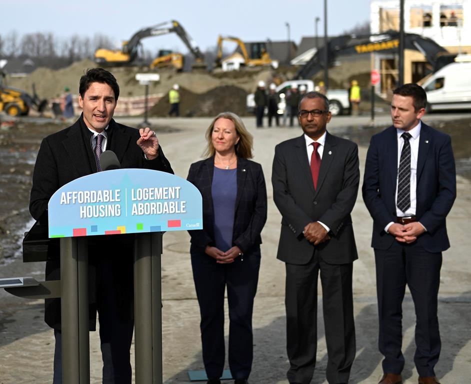 Prime Minister Justin Trudeau speaks during a press conference highlighting the first-time homebuyer incentive, at Tamarack Homes' Cardinal Creek Village development in Ottawa on Wednesday, March 20, 2019. Looking on are Liberal MPs Mona Fortier, Chandra Arya and Francis Drouin. THE CANADIAN PRESS/Justin Tang
