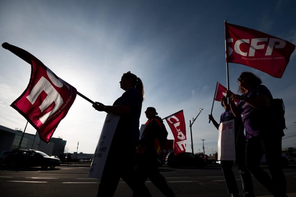 CUPE members and supporters join a demonstration in the east-end of Ottawa on Nov. 4, 2022. THE CANADIAN PRESS/Spencer Colby
