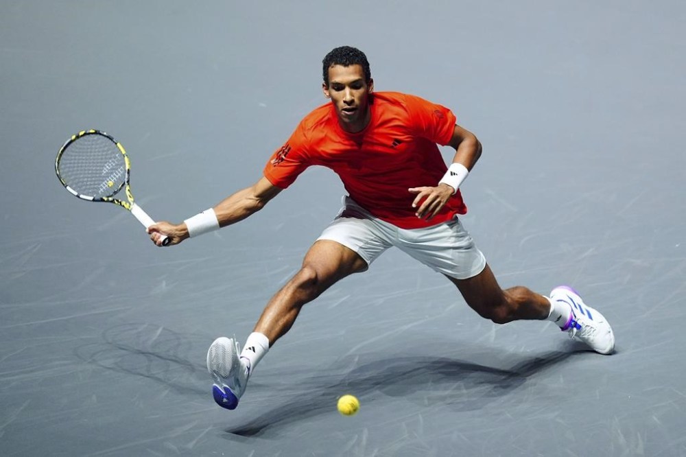 Canada's Félix Auger-Aliassime advanced to the final of the Adelaide International on Friday, defeating top-seeded American Tommy Paul in the semifinals. Auger-Aliassime returns the ball to Britain's Jack Draper during their Davis Cup group stage finals match in Manchester, Eng., Sunday, Sept. 15, 2024. THE CANADIAN PRESS/AP-Mike Egerton/PA via AP