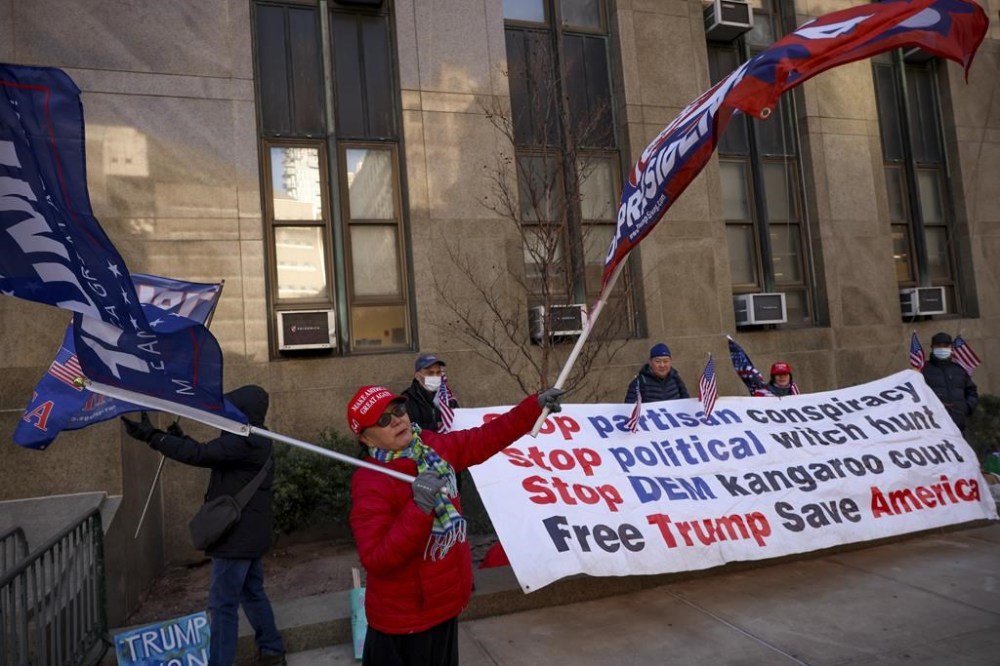 Demonstrators protest outside Manhattan criminal court before the start of the sentencing in President-elect Donald Trump's hush money case, Friday, Jan. 10, 2025, in New York. (AP Photo/Yuki Iwamura)