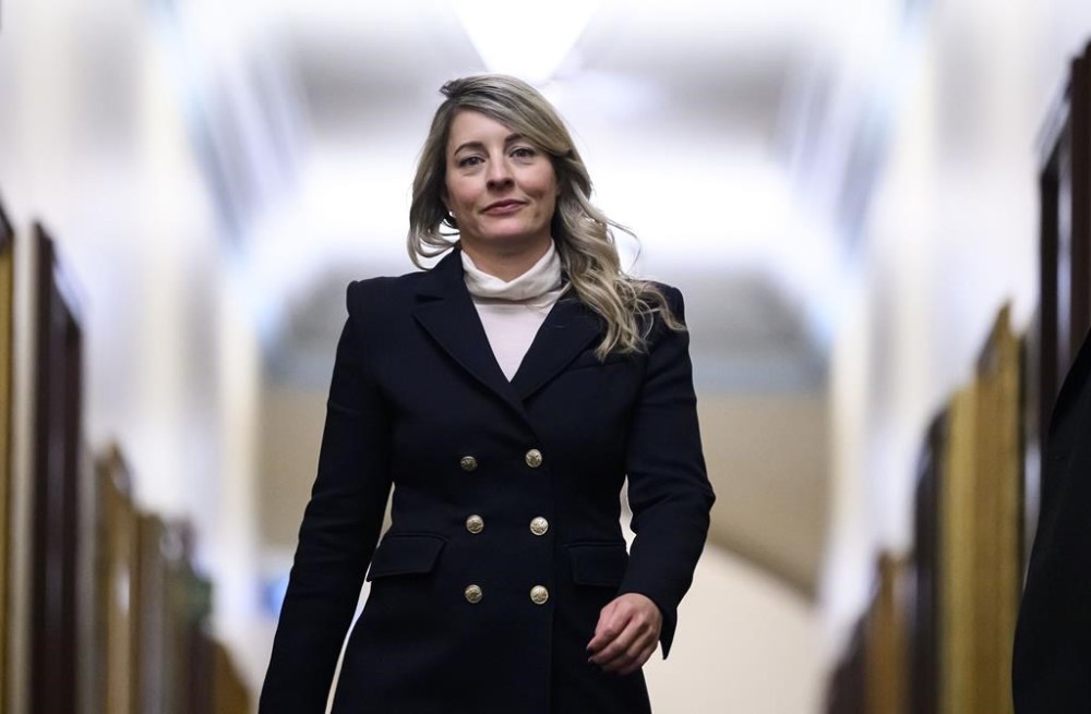 Minister of Foreign Affairs Melanie Joly returns to a Liberal Party caucus meeting in West Block on Parliament Hill, in Ottawa, Wednesday, Jan. 8, 2025. Joly will head to Washington next week to advocate that the incoming Trump administration to hold back on tariffs that would damage the Canadian economy.THE CANADIAN PRESS/Justin Tang