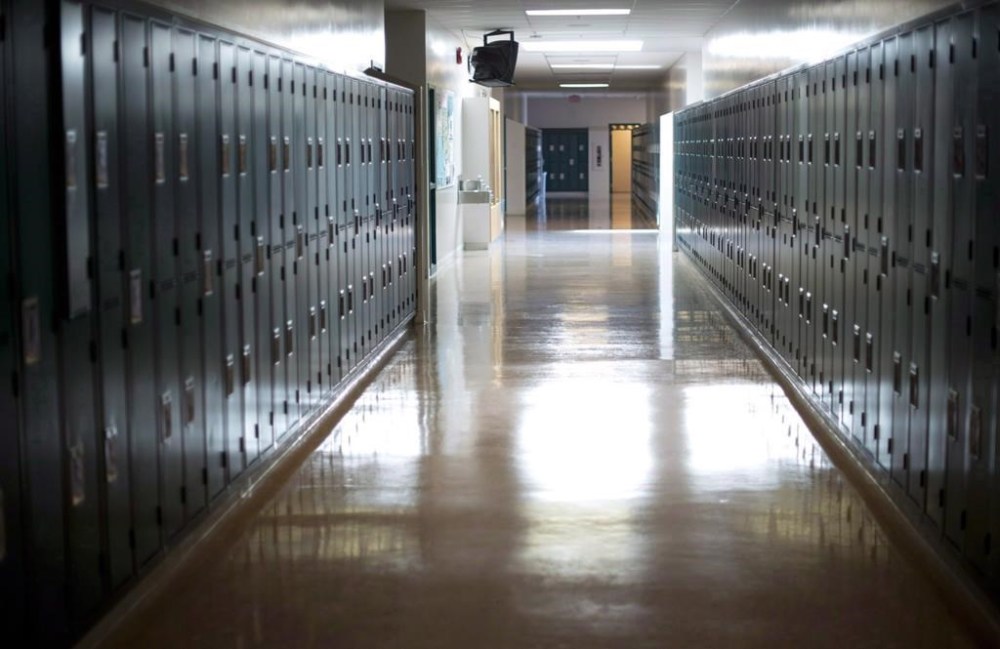 An empty hallway is seen at McGee Secondary school in Vancouver, on Sept. 5, 2014. More than 3,000 school support workers are to walk off the job this morning in Edmonton and some nearby communities over a wage dispute with their employers. THE CANADIAN PRESS/Jonathan Hayward