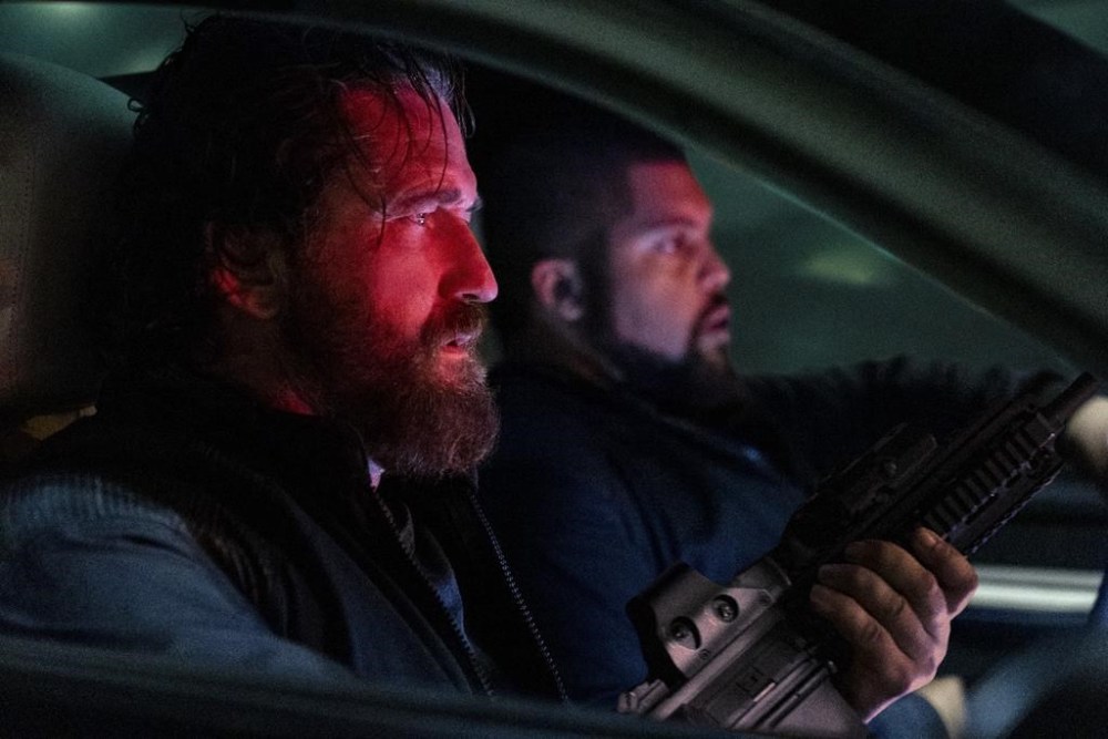 This image released by Lionsgate shows Gerard Butler, left, and O'Shea Jackson Jr. in a scene from