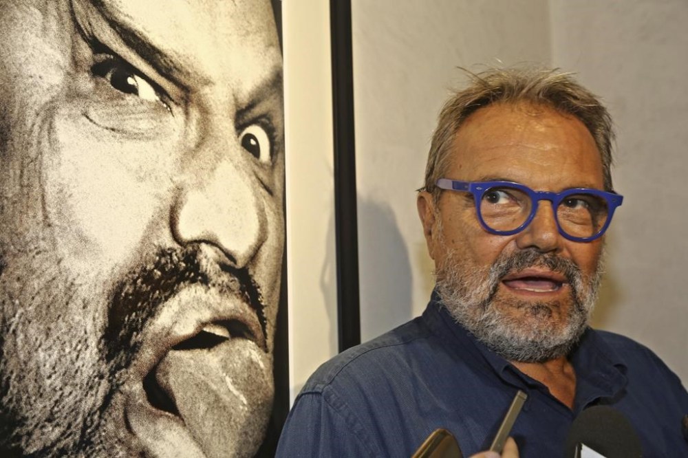 Italian photographer Oliviero Toscani is pictured in front of one of his works, a self-portrait, at the former Church of St. Pier Scheraggio, in Florence, Italy, Sept. 7, 2016. (Leonardo Bianchi/LaPresse via AP)