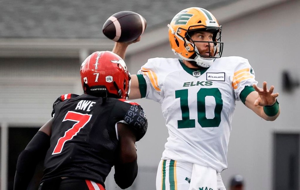 Edmonton Elks quarterback McLeod Bethel-Thompson (10) throws the ball as Calgary Stampeders' Awe Micah (7) closes in during second half CFL football action in Calgary, Monday, Sept. 2, 2024.Jason Maas expects veteran quarterback Bethel-Thompson to be a Montreal Alouette sooner rather than later.THE CANADIAN PRESS/Jeff McIntosh