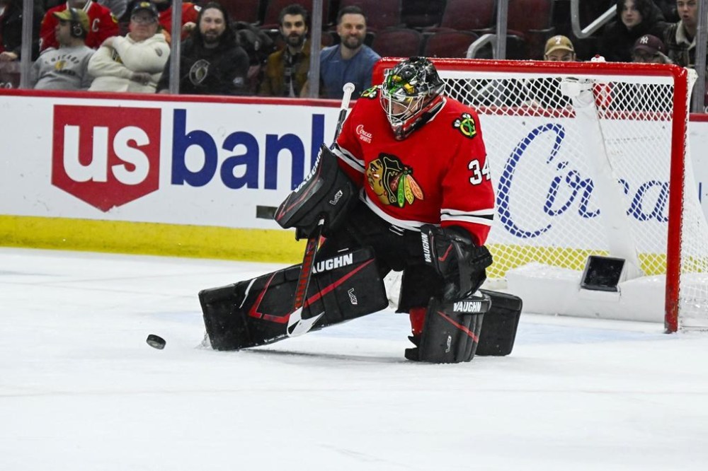 Chicago Blackhawks goaltender Petr Mrazek (34) defends against the Calgary Flames during the first period of an NHL hockey game, Monday, Jan. 13, 2025, in Chicago. (AP Photo/Matt Marton)