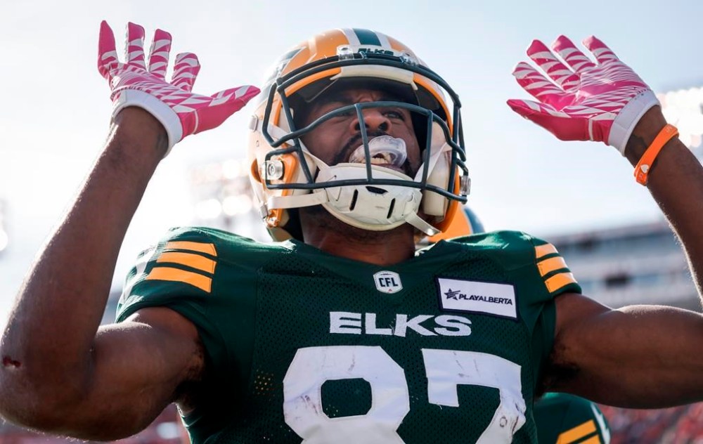 Edmonton Elks' Eugene Lewis celebrates his touchdown during first half CFL football action against the Calgary Stampeders, in Calgary, Alta., Saturday, Oct. 12, 2024.THE CANADIAN PRESS/Jeff McIntosh