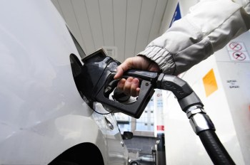 A person pumps gas at a gas station in Mississauga, Ont., Tuesday, Feb. 13, 2024. THE CANADIAN PRESS/Christopher Katsarov