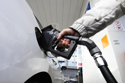 A person pumps gas at a gas station in Mississauga, Ont., Tuesday, Feb. 13, 2024. THE CANADIAN PRESS/Christopher Katsarov
