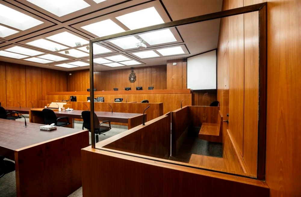 Defendant box in a courtroom at the Edmonton Law Courts building, in Edmonton, Friday, June 28, 2019. THE CANADIAN PRESS/Jason Franson