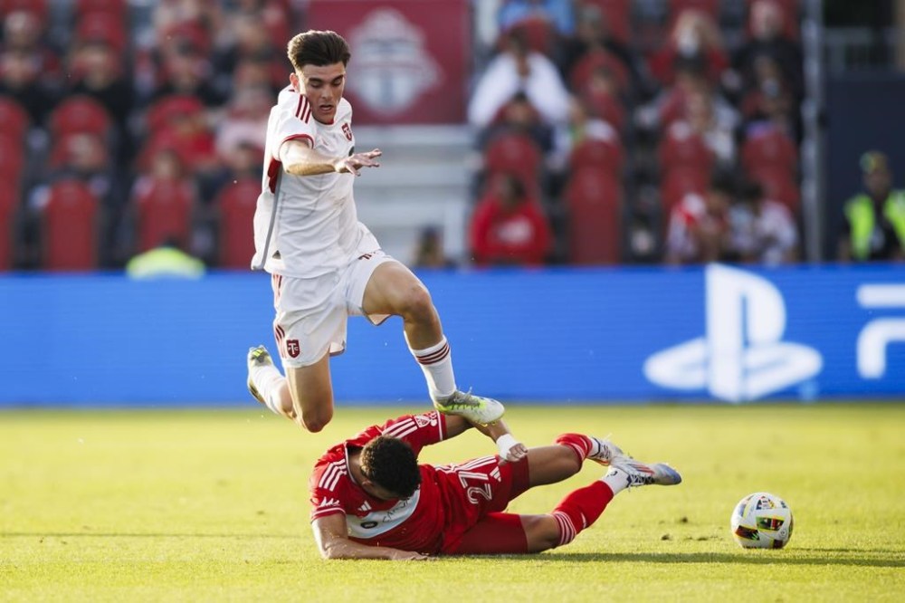 Toronto FC midfielder Alonso Coello (14) leaps over Chicago Fire defender Allan Arigoni (27) during first half MLS action in Toronto on Saturday, June 15, 2024.
Toronto FC has rewarded Coello with a contract extension.THE CANADIAN PRESS/Cole Burston