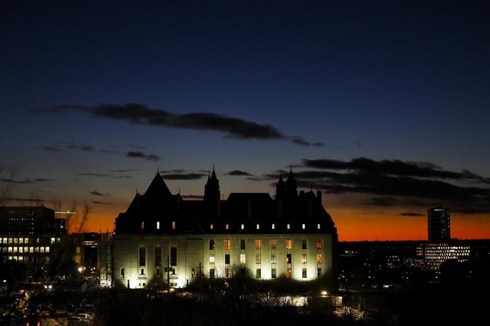 The Supreme Court of Canada says it won't hear from a group of Indigenous elders who were seeking to have input on the possibility of unmarked graves at the site of a Montreal university expansion projects. The Supreme Court of Canada is pictured at sunset in Ottawa on Wednesday, Dec. 13, 2023. THE CANADIAN PRESS/Sean Kilpatrick