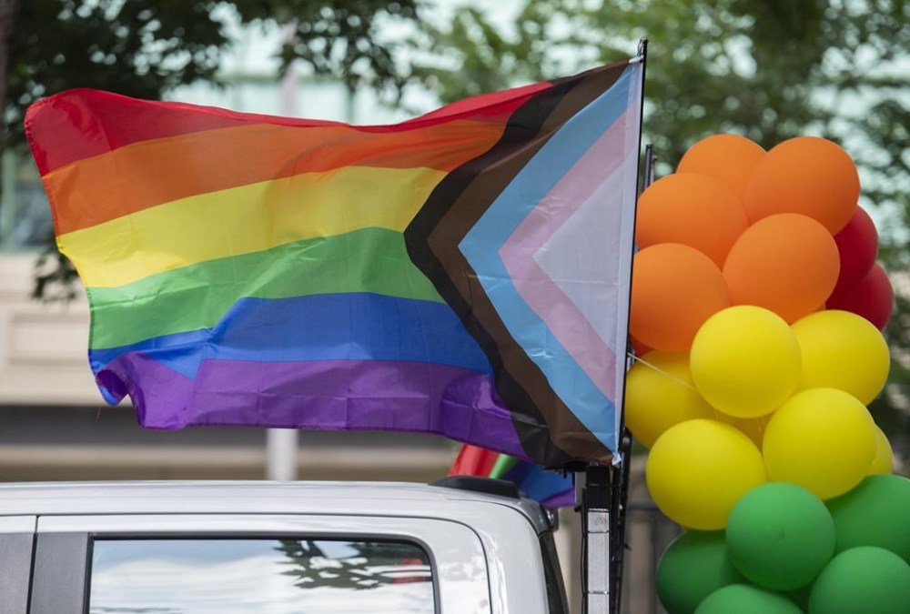 Rainbow flags and coloured balloons are shown at the site where the Montreal Pride parade was supposed to start from in Montreal on Aug. 7, 2022. THE CANADIAN PRESS/Graham Hughes