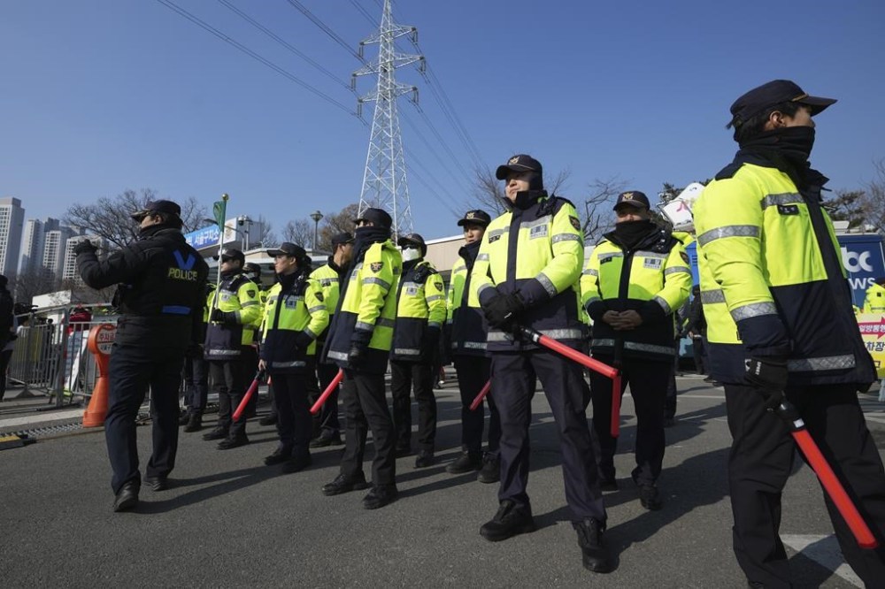 Police officers stand guard outside of a detention center where Yoon is sent in Uiwang, South Korea, Friday, Jan. 17, 2025. (AP Photo/Lee Jin-man)
