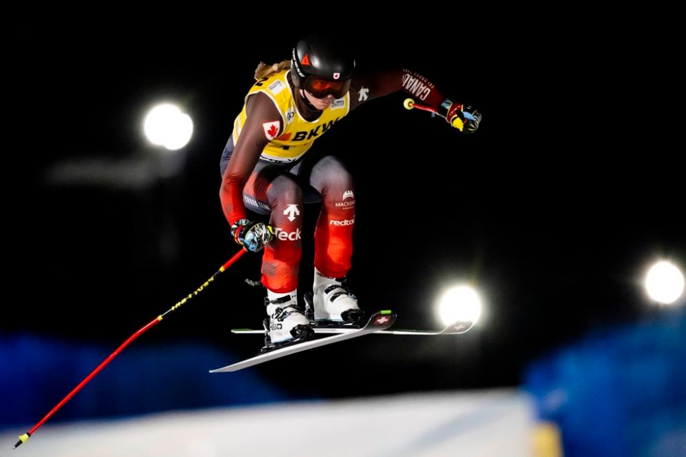India Sherret of Canada in action during the women's qualification run of the FIS Skicross World Cup, in Arosa, Switzerland, Monday, Dec. 16, 2024. Sherret of Cranbrook, B.C., captured gold on Friday, the final day of World Cup ski cross racing in Reiteralm, Austria.THE CANADIAN PRESS/Jean-Christophe Bott/Keystone via AP