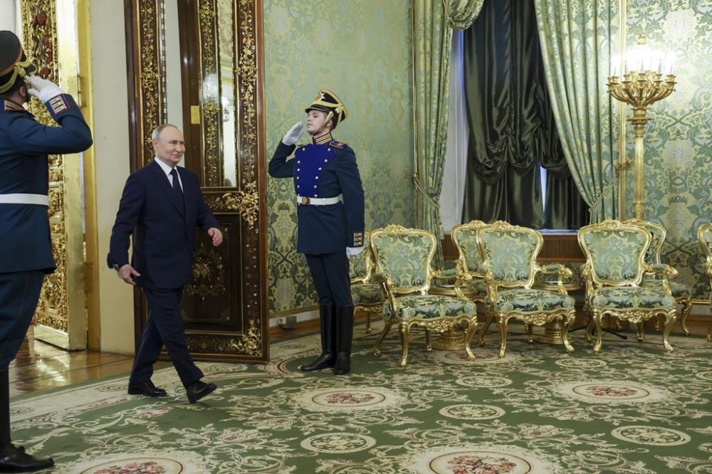 Russian President Vladimir Putin arrives to meet Iranian President Masoud Pezeshkian at the Kremlin in Moscow, Russia, Friday, Jan. 17, 2025. (Vyacheslav Prokofyev, Sputnik, Kremlin Pool Photo via AP)