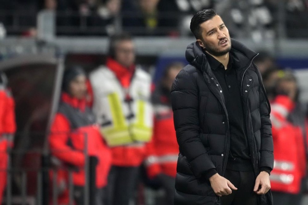 Dortmund's head coach Nuri Sahin grimaces during the German Bundesliga soccer match between Eintracht Frankfurt and Borussia Dortmund in Frankfurt, Germany, Friday, Jan. 17, 2025. (AP Photo/Michael Probst)