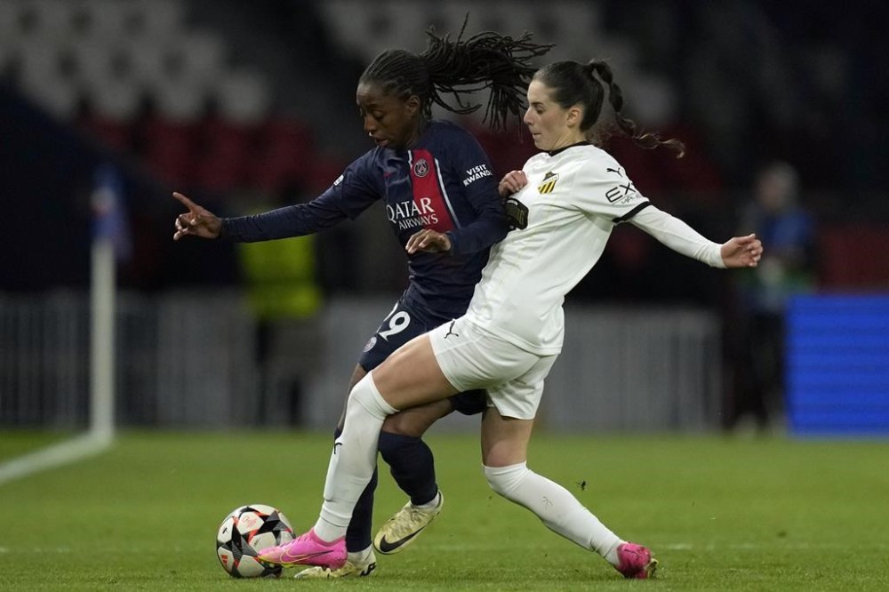 Hacken's Clarissa Larisey vies for the ball with PSG's Manssita Traore, left, during the women's Champions League quarterfinals, second leg, soccer match between Paris Saint-Germain and BK Hacken at Parc des Princes, in Paris, Thursday, March 28, 2024. THE CANADIAN PRESS/AP-Thibault Camus