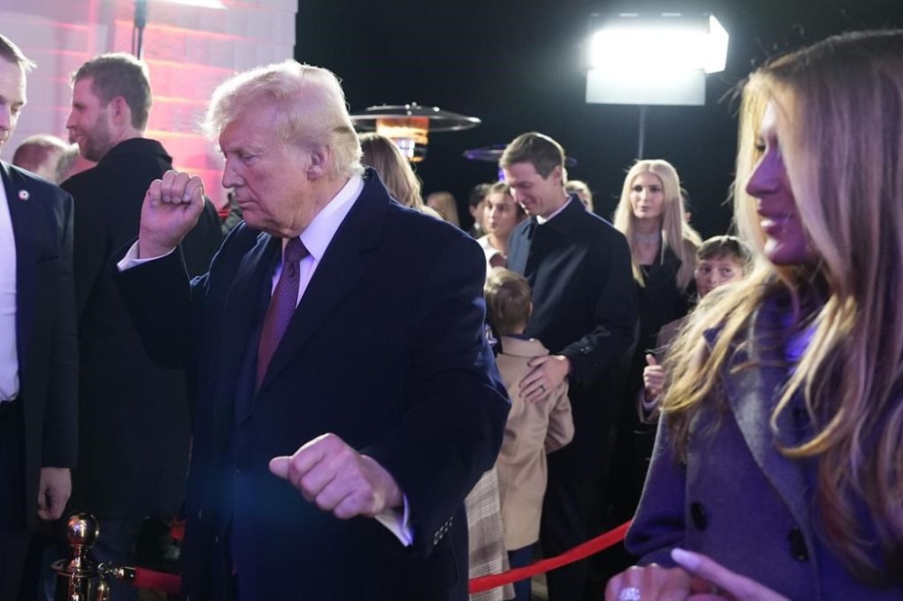 President-elect Donald Trump, with Melania Trump, right, dances after watching fireworks at Trump National Golf Club, Saturday, Jan. 18, 2025, in Sterling, Va. THE CANADIAN PRESS/AP-Alex Brandon