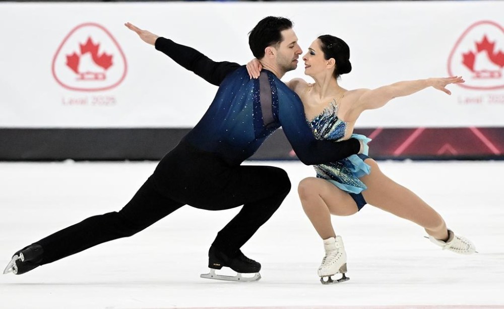 Deanna Stellato-Dudek and Maxime Deschamps perform their pair's free program at the Canadian National Skating Championships in Laval, Que., Saturday, January 18, 2025. THE CANADIAN PRESS/Graham Hughes